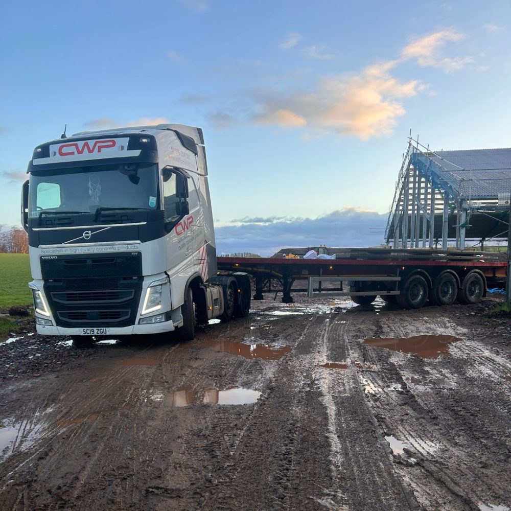 The CWP lorry on site, while concrete wall panels are being unloaded. 